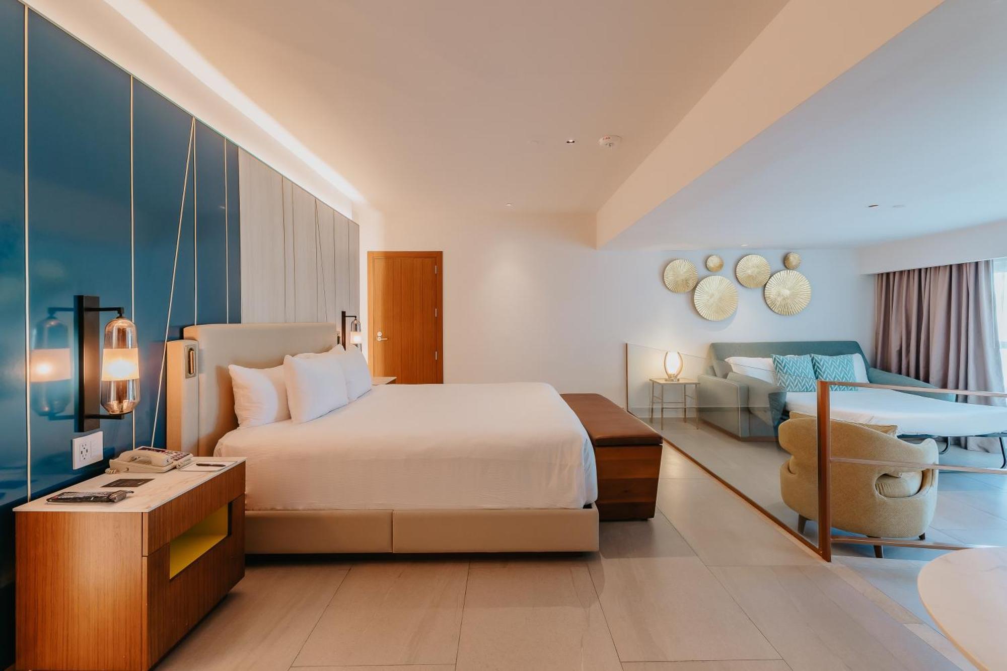 Suite Caribeña adaptada con cama extragrande y sofá cama
