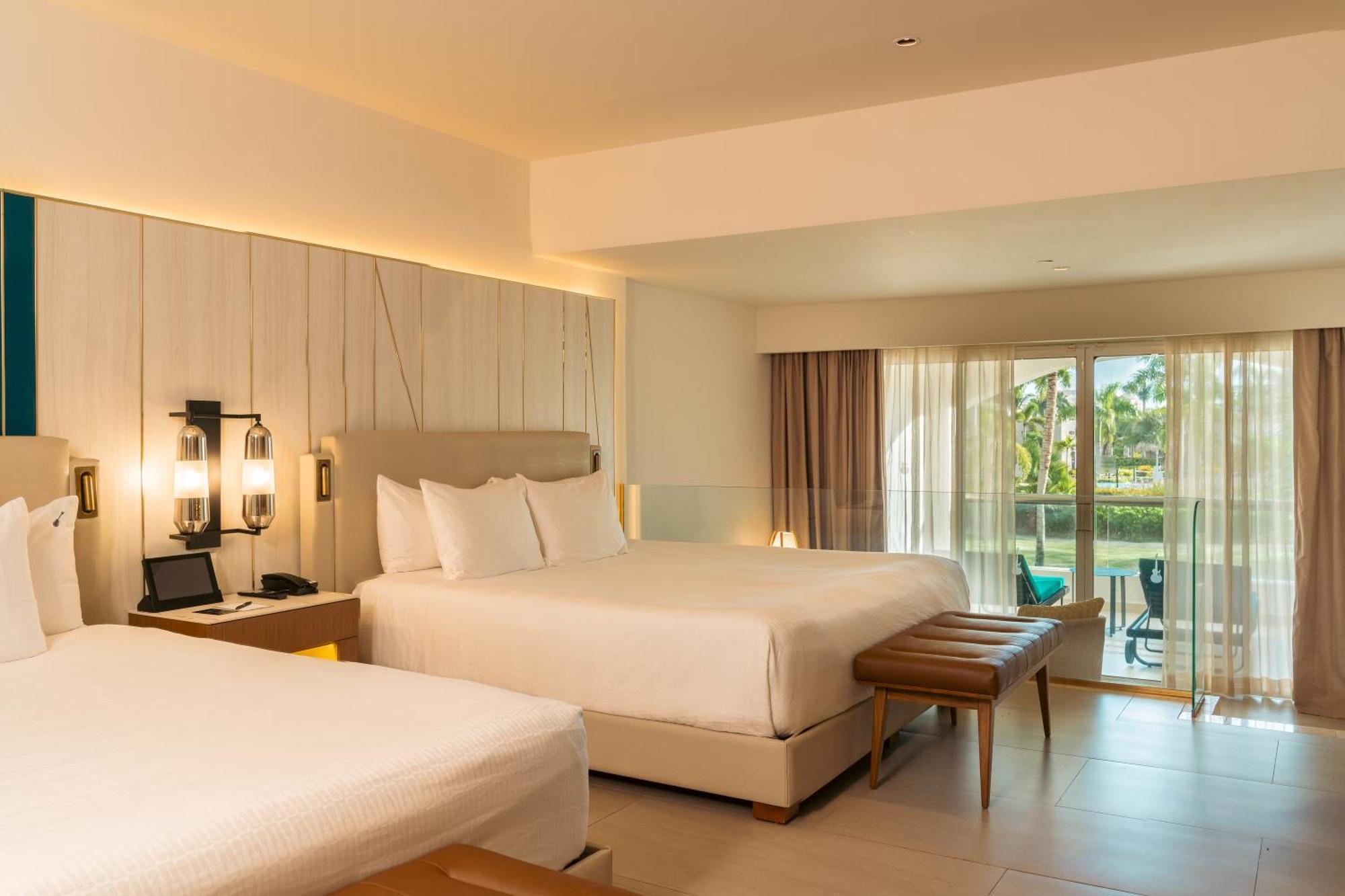 Suite Junior Islander con 2 camas grandes y sofá